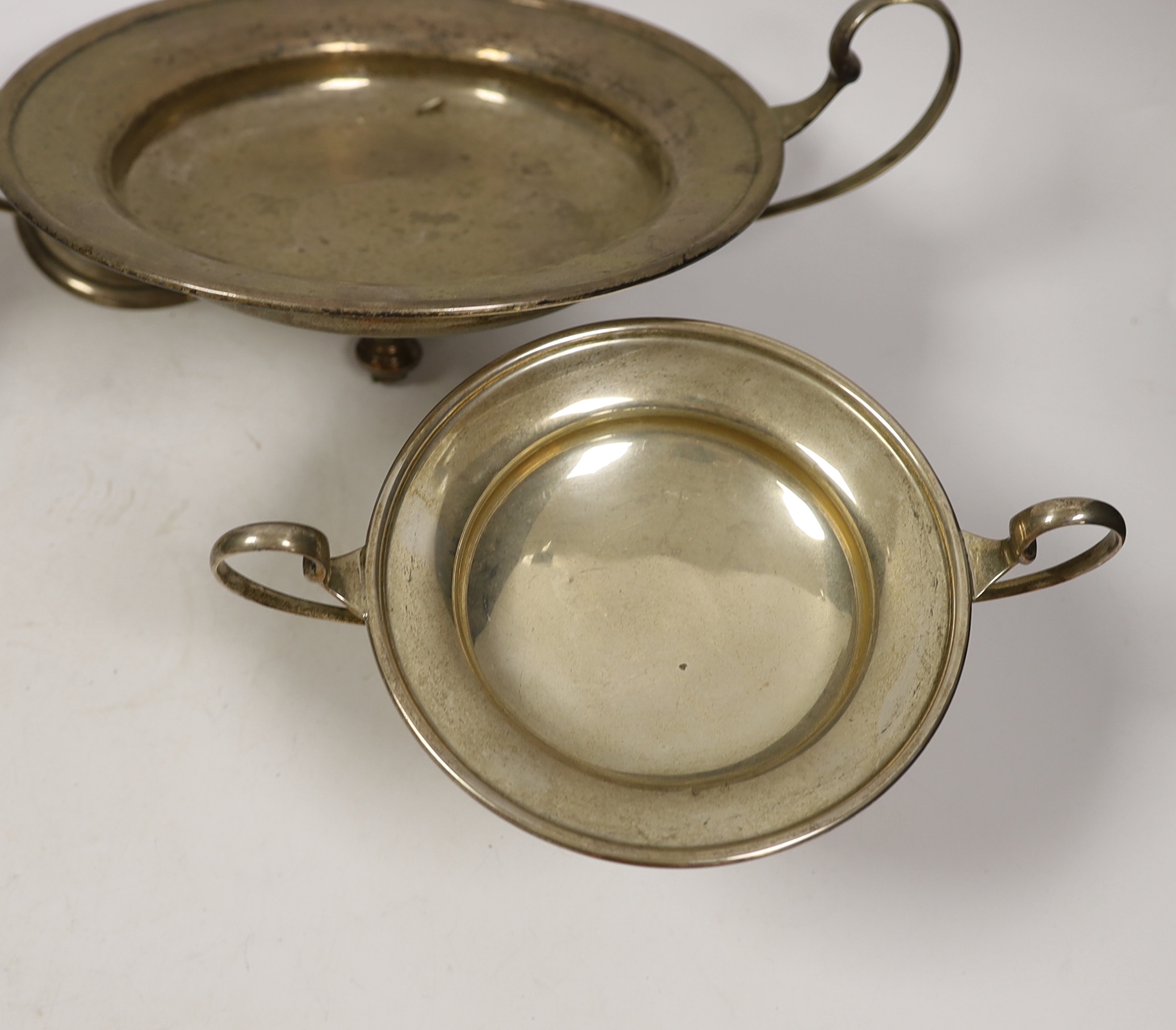 A pair of George V silver two handled fruit stands, Mappin & Webb, London, 1925, height 13.8cm and a larger damaged silver fruit stand, 38.3oz.